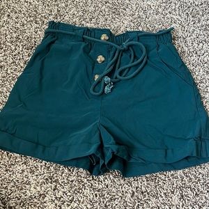 High rise, paper bag shorts.  Buttons for detailing only.